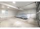 Clean, bright garage with modern lighting and covered car at 3611 W 79Th Ave # B4, Westminster, CO 80030