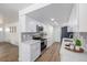 Cozy kitchen featuring stainless steel appliances, white cabinets, and hard surface floors at 3611 W 79Th Ave # B4, Westminster, CO 80030