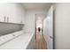 Well-lit laundry room with white cabinetry and modern washer and dryer at 3611 W 79Th Ave # B4, Westminster, CO 80030