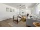 Bright living room featuring wood floors, a modern ceiling fan, and updated paint at 3611 W 79Th Ave # B4, Westminster, CO 80030