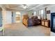 Large main bedroom featuring ceiling fan, ensuite bathroom, and natural light at 1995 E 166Th Ave, Thornton, CO 80602