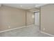 Finished basement with plush neutral carpet, white door and natural light at 9436 Cody Dr, Broomfield, CO 80021