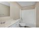 Cozy bathroom featuring a tub with a shower, a toilet, and a sink with a white cabinet at 9436 Cody Dr, Broomfield, CO 80021