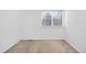 An empty bedroom featuring neutral carpet, white walls, and a bright window at 9436 Cody Dr, Broomfield, CO 80021