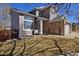 Attractive two-story home featuring stone accents and a well-maintained lawn at 9436 Cody Dr, Broomfield, CO 80021