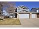 Charming two-story home featuring a three-car garage and stone accents, offering ample space and curb appeal at 9436 Cody Dr, Broomfield, CO 80021