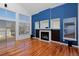 Inviting living room has hardwood floors, a fireplace with built-ins, and lots of natural light at 9436 Cody Dr, Broomfield, CO 80021