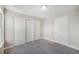 Bedroom featuring new carpet, neutral colored walls, closet and interior door at 2239 S Jasper Way # A, Aurora, CO 80013