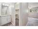 Bedroom with a view of a walk-in closet, bathroom and nature seen through the window at 2239 S Jasper Way # A, Aurora, CO 80013