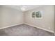 Bright bedroom featuring new carpet, window and neutral colored walls at 2239 S Jasper Way # A, Aurora, CO 80013