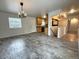 Open-concept dining area with ample space and access to kitchen and living spaces at 6537 Everett St, Arvada, CO 80004