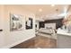 Spacious main bedroom boasts elegant wall decor, recessed lighting, and a cozy seating area at 6537 Everett St, Arvada, CO 80004