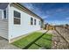 Featuring a small patch of artificial turf amidst the rock landscaping, the backyard offers low-maintenance greenery and stylish design at 2750 E 102Nd Pl, Thornton, CO 80229