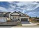 Charming two-story home with a covered porch and a two-car garage in a desirable neighborhood at 2750 E 102Nd Pl, Denver, CO 80229