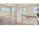 Open concept living area with sliding glass doors that provide access to the backyard and plenty of natural light at 2750 E 102Nd Pl, Thornton, CO 80229