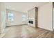 Bright living room featuring modern fireplace with floor to ceiling tile and large windows at 2750 E 102Nd Pl, Thornton, CO 80229