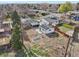 Aerial view displays a single-story house with a detached garage with solar panels and a backyard trampoline at 11360 Irma Dr, Northglenn, CO 80233