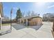 Spacious backyard featuring a large concrete area and a basketball hoop, perfect for outdoor activities at 11360 Irma Dr, Northglenn, CO 80233