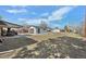 Backyard featuring a detached garage and an open yard space, providing room for various outdoor activities at 11360 Irma Dr, Northglenn, CO 80233