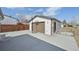 A detached two-car garage featuring basketball hoops on the back with a paved driveway at 11360 Irma Dr, Northglenn, CO 80233
