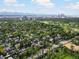 Expansive aerial view showcasing the neighborhood, Denver skyline, and lush greenery, highlighting the location at 405 S University Blvd, Denver, CO 80209