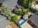 Aerial shot of a backyard with a pristine hot tub, surrounded by lush greenery and serene landscaping at 405 S University Blvd, Denver, CO 80209