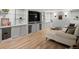Finished basement featuring built-in shelving and a sectional sofa at 405 S University Blvd, Denver, CO 80209