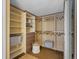 Organized walk-in closet with ample shelving, drawers, and hanging space at 405 S University Blvd, Denver, CO 80209