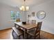 Bright dining room features a wooden table set, natural light, and simple decor at 405 S University Blvd, Denver, CO 80209