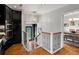 Hallway showcasing wood floors and access to the dining room and front door at 405 S University Blvd, Denver, CO 80209