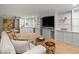 Inviting living room with custom cabinets, glass shelving, and comfortable seating at 405 S University Blvd, Denver, CO 80209