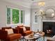 Inviting living room with a fireplace and two armchairs at 405 S University Blvd, Denver, CO 80209