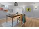 Bright office with wooden desk, stylish light fixture, and contemporary artwork at 405 S University Blvd, Denver, CO 80209