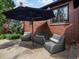 Charming patio with comfortable seating, stone flooring, and shade umbrella at 405 S University Blvd, Denver, CO 80209