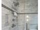 Shower features marble walls, glass door, and rainfall shower head at 405 S University Blvd, Denver, CO 80209