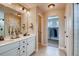 Double vanity bathroom with walk-in closet access at 4306 Canyata Dr, Elizabeth, CO 80107