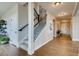 Bright entryway with hardwood floors and staircase at 4306 Canyata Dr, Elizabeth, CO 80107