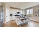 Modern kitchen with white cabinets, island, and stainless steel appliances at 4306 Canyata Dr, Elizabeth, CO 80107