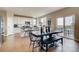 Bright kitchen features a farmhouse table and sliding glass doors to deck at 4306 Canyata Dr, Elizabeth, CO 80107