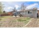 Backyard features a patio, hot tub, grill, and garden space, offering outdoor relaxation and entertainment at 12418 Albion St, Thornton, CO 80241