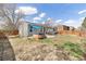 Backyard featuring a hot tub, patio area, and a grill, ideal for entertaining and relaxation at 12418 Albion St, Thornton, CO 80241