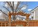 Close-up of the backyard gate featuring wooden construction, offering privacy and charm at 12418 Albion St, Thornton, CO 80241