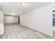 Spacious basement with plush grey carpeting and ample space for living or entertaining at 12418 Albion St, Thornton, CO 80241