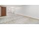 Basement with neutral carpeting and ample space for living or entertaining at 12418 Albion St, Thornton, CO 80241