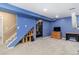 Finished basement with ample storage and blue walls at 12418 Albion St, Thornton, CO 80241