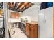 Basement workshop features ample counter space, storage, and utility connections at 12418 Albion St, Thornton, CO 80241