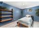Cozy bedroom with built-in shelving, ample natural light, and neutral carpeting at 12418 Albion St, Thornton, CO 80241