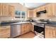 Well-equipped kitchen with stainless steel appliances, including a dishwasher and oven at 12418 Albion St, Thornton, CO 80241