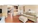 Open living area featuring wood floors connecting the living room, dining area and kitchen at 12418 Albion St, Thornton, CO 80241