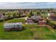 An aerial view of home and property with outbuildings in a pastoral setting at 8280 Queen St, Arvada, CO 80005